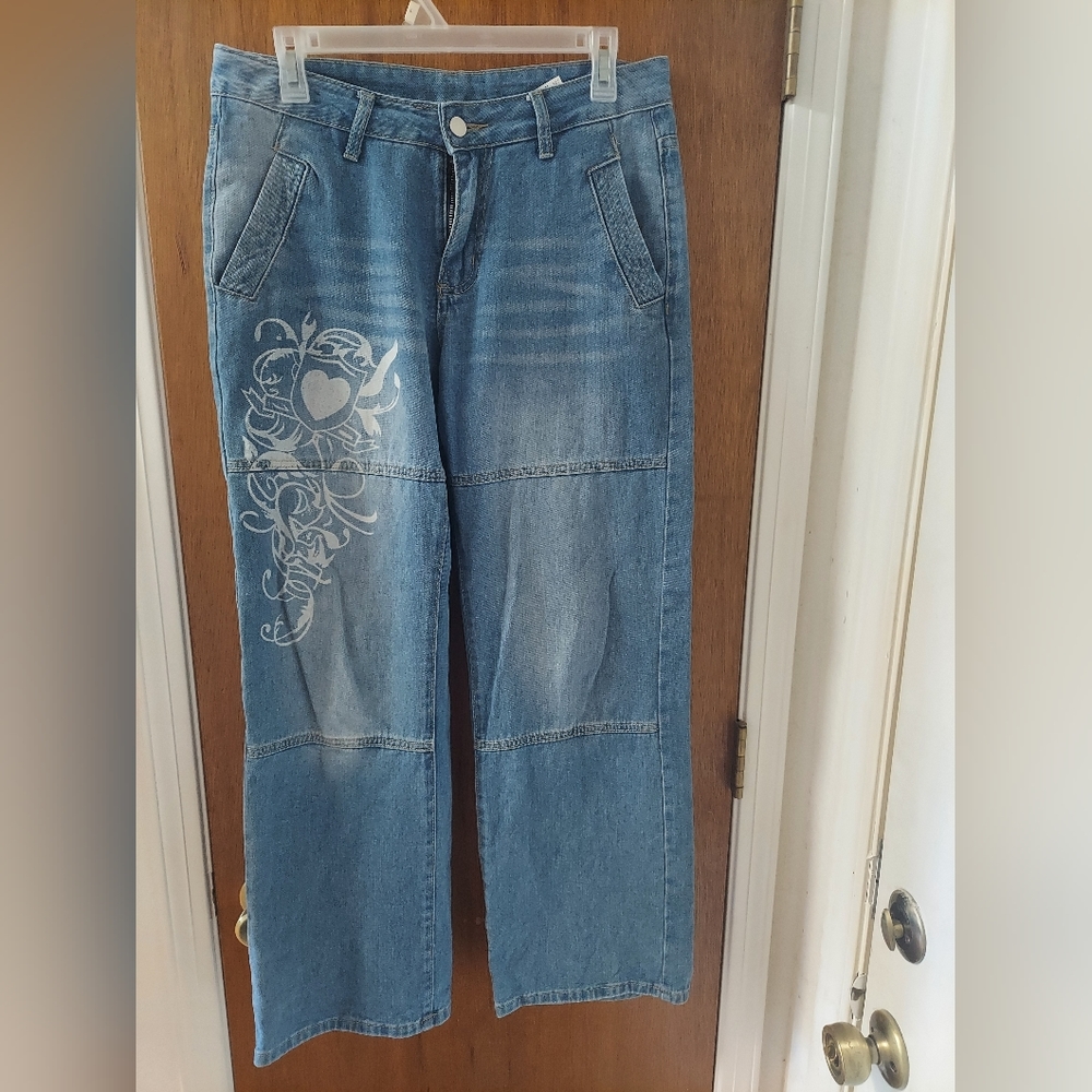 Juniors size medium. Wide leg pants with heart graphic on the front.